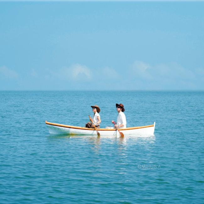 12 Ft Wooden Whitehall Rowboat with Gelcoat reinforcement, in water rowing two people inm boat