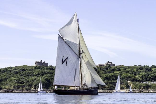 The Mascotte sailing past Pendennis Point with Pendennis Castle in the background during FH2014 photo by Roger Hollingsworth. 