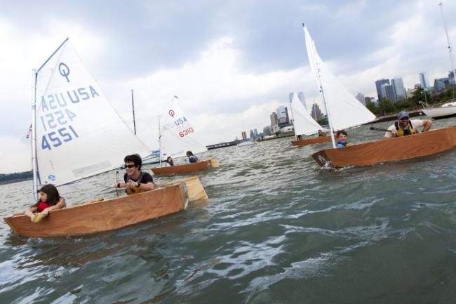 Students sailing their hand-build Optimists