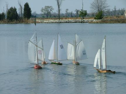 Model yachts sailing almost look like butterflies on the water.