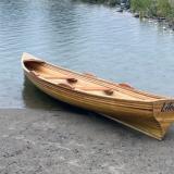 Cedar strip planked row boat.