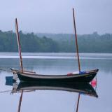 2014 Oughtred Caledonia Yawl 19', in water reflecting in the  magical mystic
