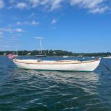 1923 Cape Cod Power Dory , in water  moored, starboard side view blue sky day