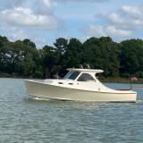 Mast & Mallet Custom Picnic Style Skiff, in water, port side