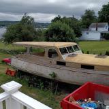 38' foot Matthews deluxe stock cruiser, on the lawn, on stands, starboard side view