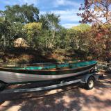 21-Foot Beachcomber Alpha Sailing Dory for sale,  on trailer port side view