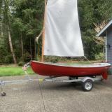 Catspaw Dinghy strip Plank Versian, on trailer sail up, port side view
