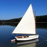 Catboat "Dell", sail up on mooring, starboard side view