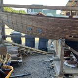 Wooden ballast keel sloop "RASCAL", port side bow end in garage