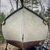  JOHN ALDEN DESIGNED CATBOAT , on the hard, bow view