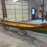 New Adirondack Guide Boat for Sale, on stands, inside 1