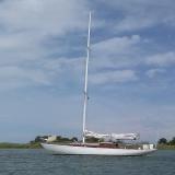 1946 44’ Island Clipper Sloop Nirvana, in water port side view
