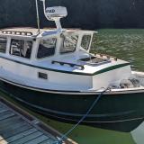 Tolman Jumbo 24, in water docked starboard side